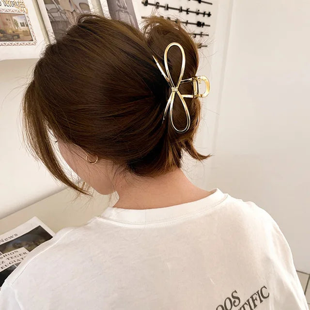 https://ae01.alicdn.com/kf/S6d9ed03598e146f5a531ac5031e6ef77K/Elegant-Bow-Metal-Hair-Claw-Clips-for-Women-Gold-Silver-Geometric-Grab-Clip-Korean-Girls-Hollow.jpg